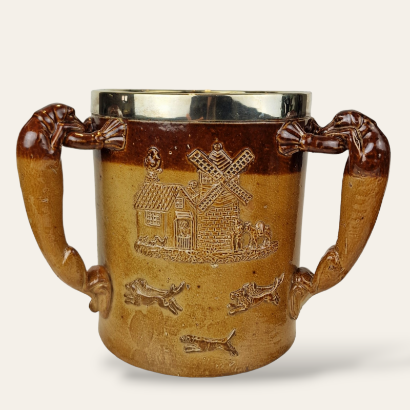 Large Doulton Lambeth, London, Loving Cup with a Solid Sterling Silver Hallmarked Rim dated 1885.