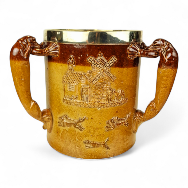 Large Doulton Lambeth, London, Loving Cup with a Solid Sterling Silver Hallmarked Rim dated 1885.